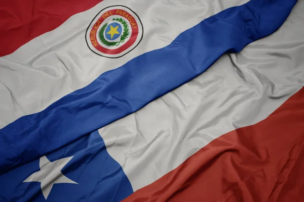 Waving colorful flag of chile and national flag of paraguay. — Stock Photo, Image