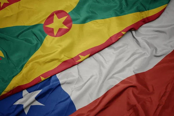 Schwenken bunte chilenische Flagge und Nationalflagge von Grenada. — Stockfoto