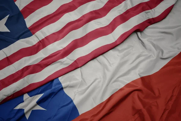 Waving colorful flag of chile and national flag of liberia. — Stock Photo, Image