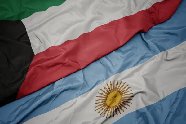 Waving colorful flag of argentina and national flag of kuwait. — Stock Photo, Image