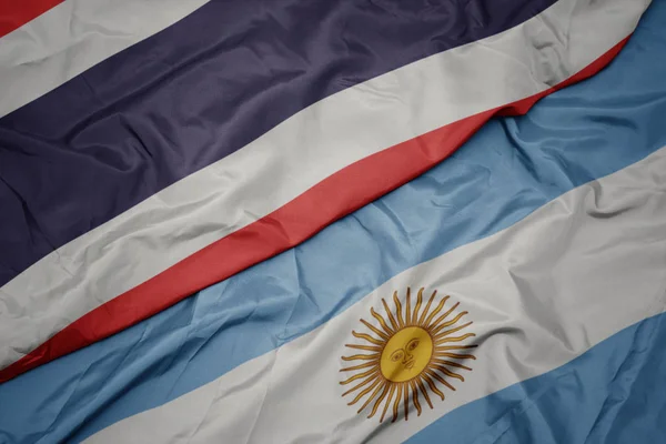 아르헨티나의 화려한 국기와 태국의 국기를 흔들어. — 스톡 사진