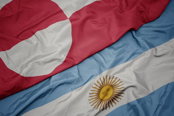 Ondeando colorida bandera de Argentina y bandera nacional de Groenlandia . —  Fotos de Stock