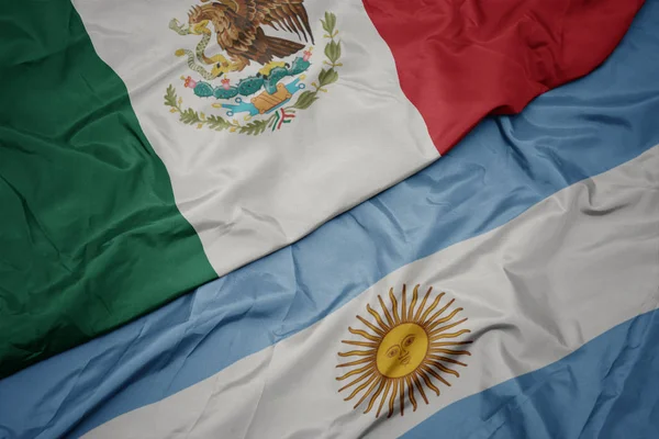 Waving colorful flag of argentina and national flag of mexico. — Stock Photo, Image