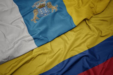 kolombiya ve kanarya adalarının ulusal bayrağı renkli bayrak sallayarak