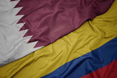 kolombiya ve katar ulusal bayrağı renkli bayrak sallayarak.