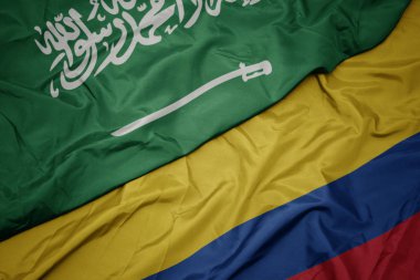 Kolombiya ve Suudi Arabistan ulusal bayrağı renkli bayrak sallayarak.