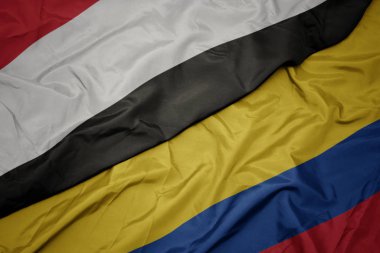 kolombiya ve yemen ulusal bayrağı renkli bayrak sallayarak.