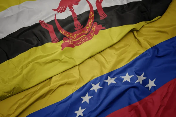 Waving colorful flag of venezuela and national flag of brunei. — Stock Photo, Image