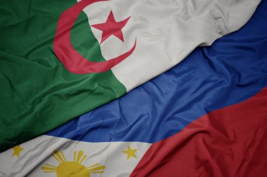 Filipinler ve Cezayir ulusal bayrağı renkli bayrak sallayarak.