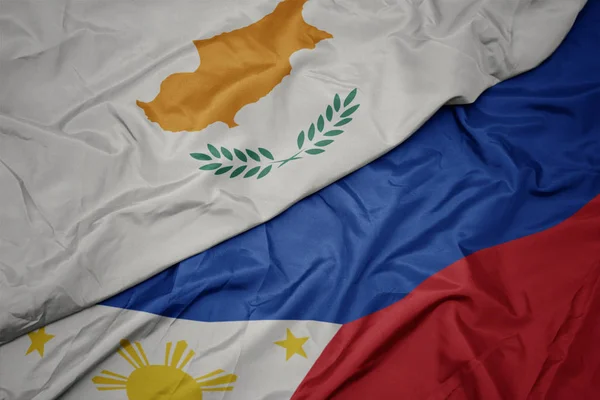 Ondeando colorida bandera de Filipinas y bandera nacional de Ciprus . —  Fotos de Stock