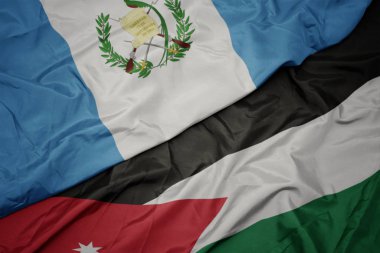 ürdün ve guatemala ulusal bayrağı renkli bayrak sallayarak.
