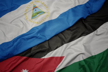 ürdün renkli bayrak ve nikaragua ulusal bayrağı sallayarak.