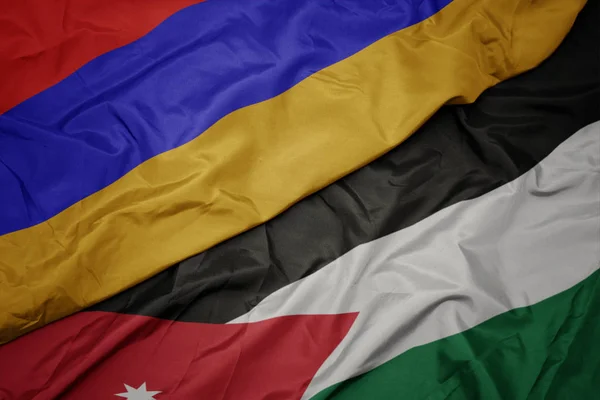 Acenando bandeira colorida da Jordânia e bandeira nacional da Arménia . — Fotografia de Stock