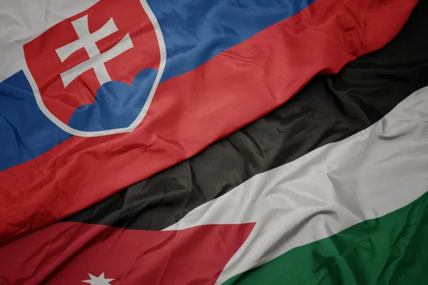 Sventolando bandiera colorata della Giordania e bandiera nazionale della Slovacchia . — Foto Stock