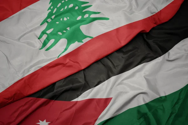Sventolando bandiera colorata della Giordania e bandiera nazionale del Libano . — Foto Stock