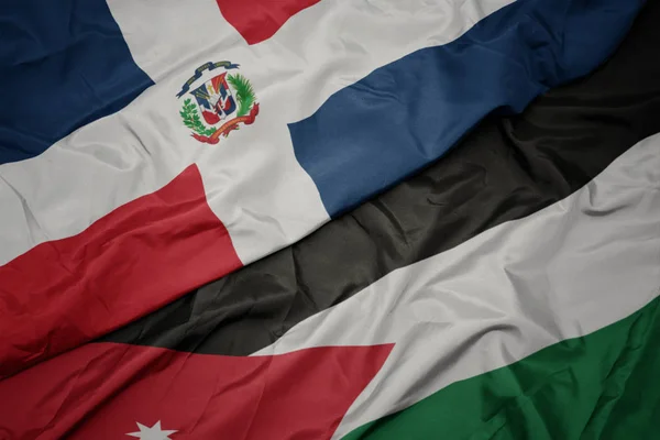 Ondeando colorida bandera de Jordania y bandera nacional de la república dominicana . — Foto de Stock