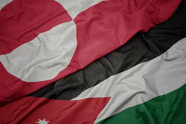 Acenando bandeira colorida da Jordânia e bandeira nacional da Groenlândia . — Fotografia de Stock