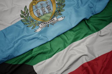 kuveyt renkli bayrak ve san marino ulusal bayrağı sallayarak.