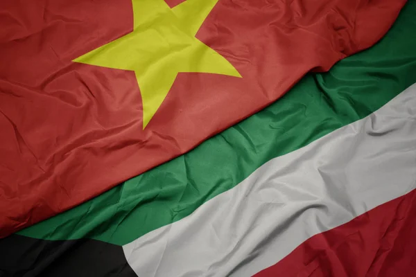 Waving colorful flag of kuwait and national flag of vietnam. — Stock Photo, Image