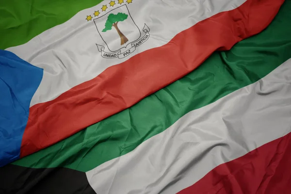 Ondeando colorida bandera de kuwait y bandera nacional de Guinea Ecuatorial . —  Fotos de Stock