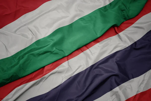 Waving colorful flag of thailand and national flag of hungary. — Stock Photo, Image