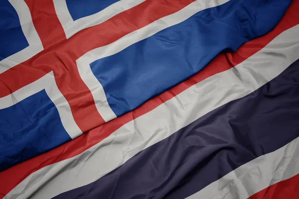 Waving colorful flag of thailand and national flag of iceland. — Stock Photo, Image