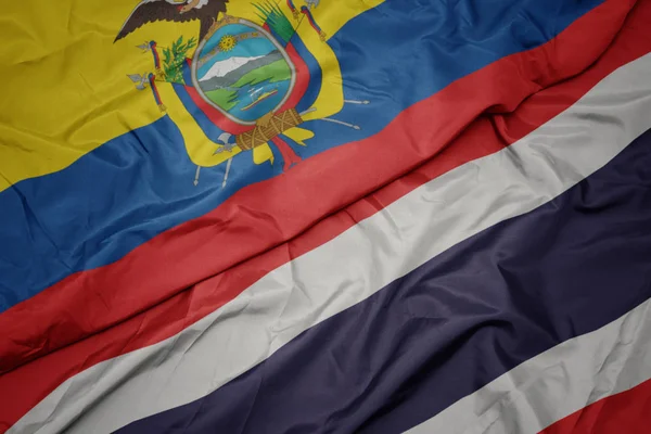 Ondeando colorida bandera de Tailandia y bandera nacional de Ecuador . —  Fotos de Stock