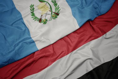 yemen ve guatemala ulusal bayrağı renkli bayrak sallayarak.