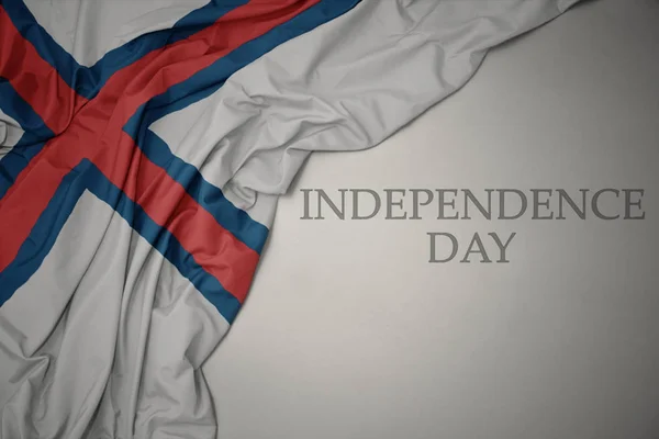 텍스트 독립 기념일회색 배경에 페로 섬의 화려한 국기를 흔들. — 스톡 사진