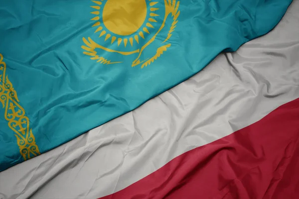 Polonya ve kazakistan ulusal bayrağı renkli bayrak sallayarak. — Stok fotoğraf