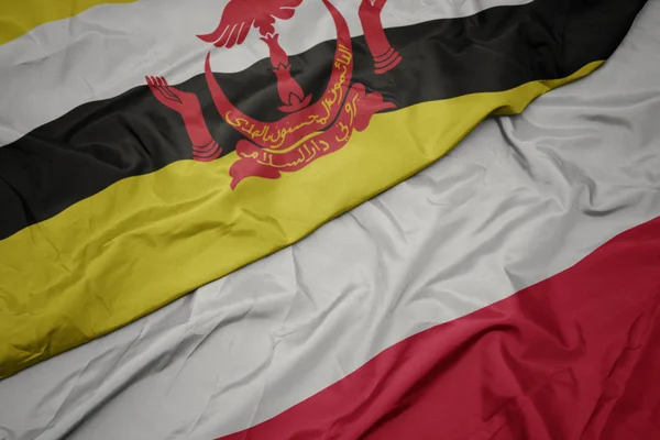 Waving colorful flag of poland and national flag of brunei. — Stock Photo, Image