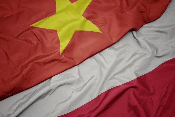 Waving colorful flag of poland and national flag of vietnam. — Stock Photo, Image
