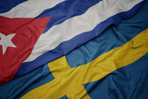 Waving colorful flag of sweden and national flag of cuba. — Stock Photo, Image
