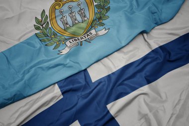 Finlandiya 'nın renkli bayrağı ve San Marino' nun ulusal bayrağı sallanıyor..