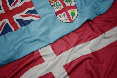 Danimarka 'nın renkli bayrağı ve Fiji' nin ulusal bayrağı sallanıyor. .