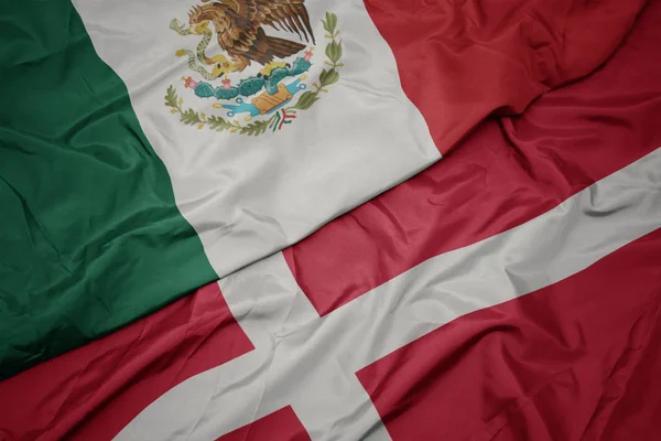 Waving colorful flag of denmark and national flag of mexico. — Stock Photo, Image