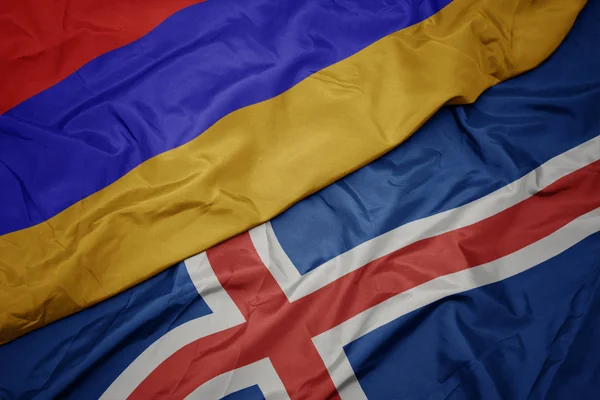 Ondeando colorida bandera de iceland y bandera nacional de armenia . —  Fotos de Stock