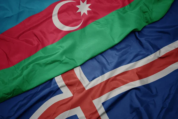アイスランドのカラフルな旗とアゼルバイジャンの国旗を振って. — ストック写真