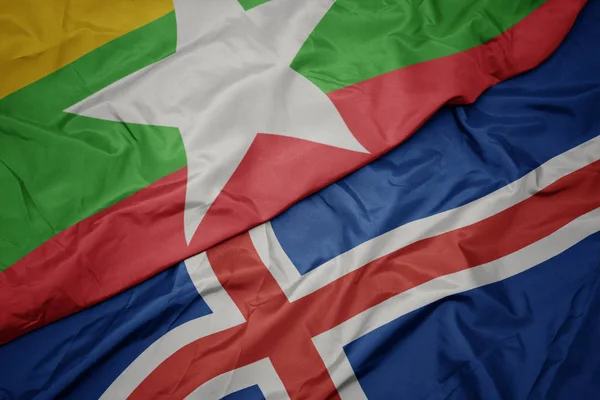 アイスランドのカラフルな旗とミャンマーの国旗を振って. — ストック写真