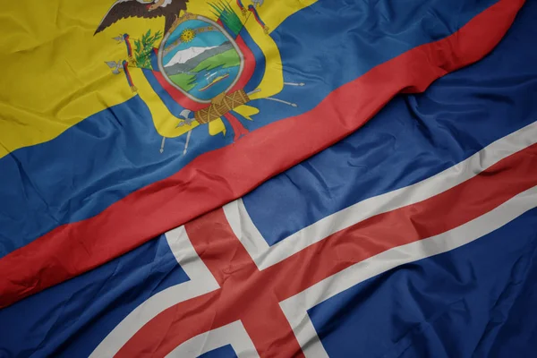 Ondeando colorida bandera de iceland y bandera nacional de ecuador . —  Fotos de Stock