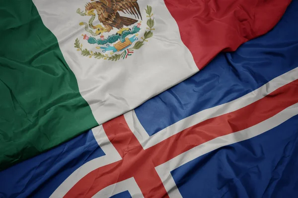 Waving colorful flag of iceland and national flag of mexico. — Stock Photo, Image