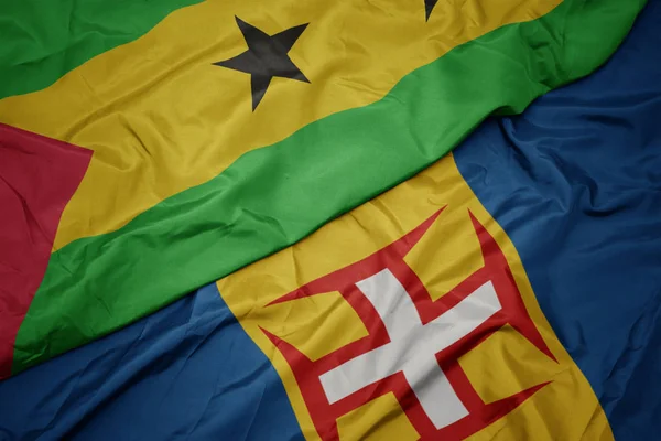 Zwaaiende vlag van madeira en nationale vlag van sao tome en principe . — Stockfoto