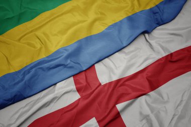 İngiltere 'nin renkli bayrağı ve Gabon' un ulusal bayrağı sallanıyor..