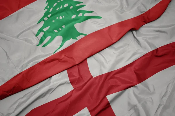 Waving colorful flag of england and national flag of lebanon. — Stock Photo, Image