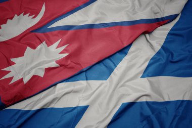 İskoçya 'nın renkli bayrağı ve Nepal' in ulusal bayrağı sallanıyor..