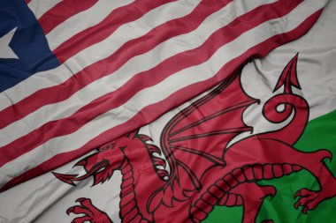 Galler 'in renkli bayrağı ve Liberya' nın ulusal bayrağı sallanıyor..