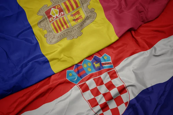 Mávání barevnou vlajkou Chorvatska a národní vlajky andorry. — Stock fotografie