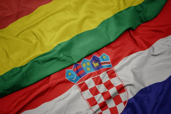 Waving colorful flag of croatia and national flag of bolivia. — Stock Photo, Image