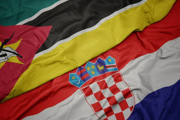 Waving colorful flag of croatia and national flag of mozambique. — Stock Photo, Image