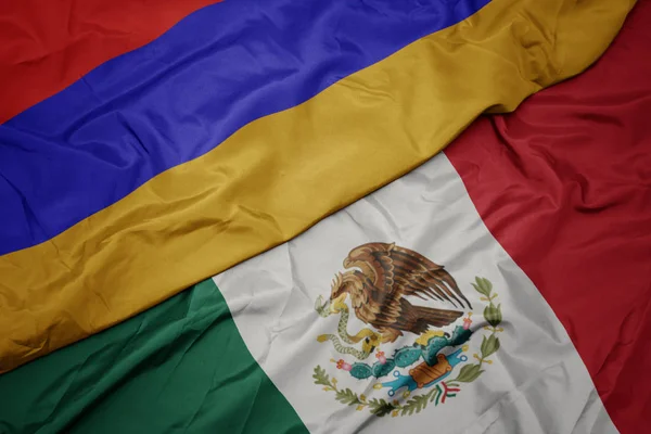 Ondeando colorida bandera de México y bandera nacional de Armenia. macro —  Fotos de Stock